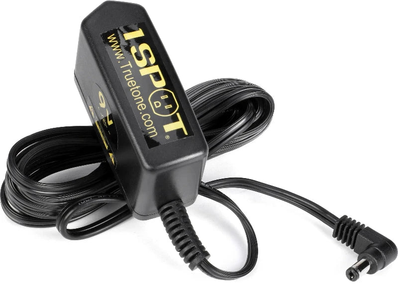 Truetone 1 SPOT 9V power supply for guitar pedals, black with long coiled cable and DC barrel plug.