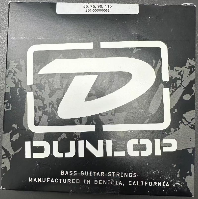 Dunlop bass strings box with black packaging and large white logo; gauge set 55-75-90-110.