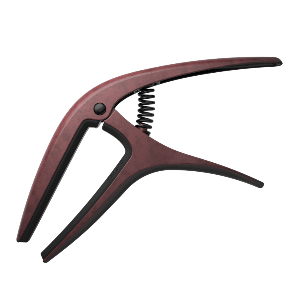 Wooden guitar capo on a white background