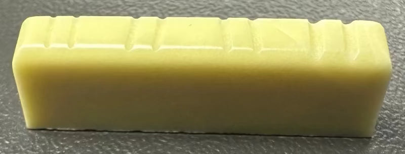 Plastic Nut Assortment for NA-2901-000 Dreadnaught Strat by Allparts, yellow plastic guitar nut blocks