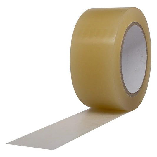 A roll of clear vinyl tape unrolling to show its adhesive properties and transparency.