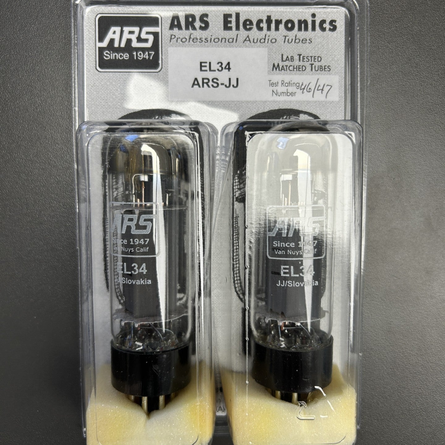 Two vacuum tubes in packaging with ARS Electronics branding on a gray background