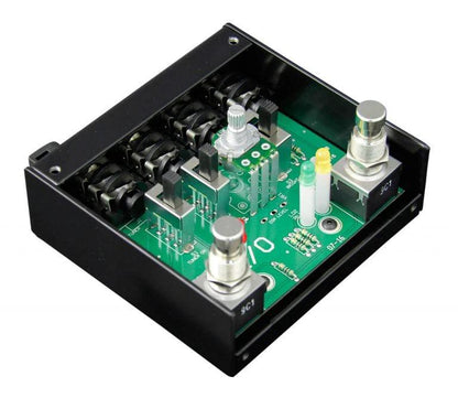 Electronic control module with green circuit board and metal components on a white background