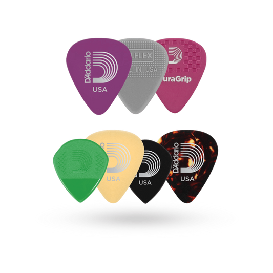Set of guitar picks with D'Addario branding on a clear background
