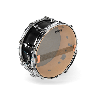 Evans Snare Side 300 drumhead mounted on a black snare drum with chrome hardware