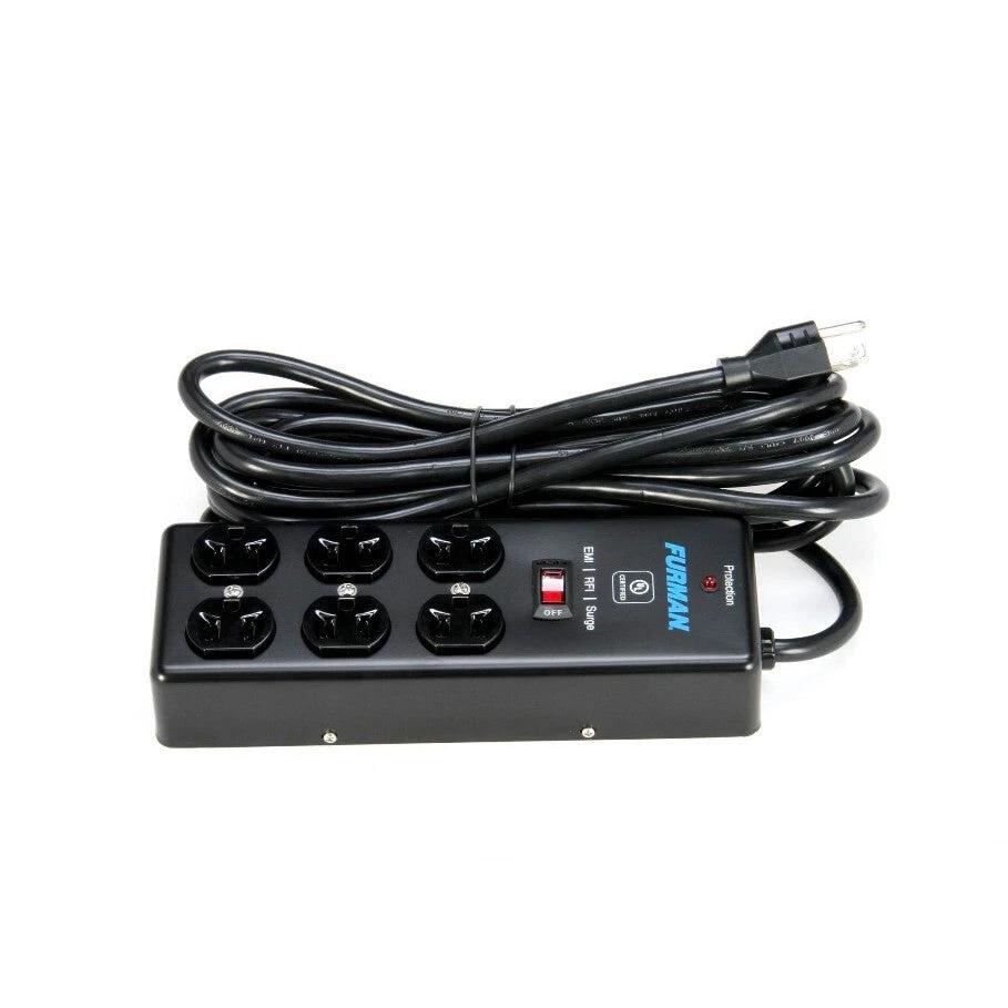 Black power strip with multiple outlets and a USB port on a white background