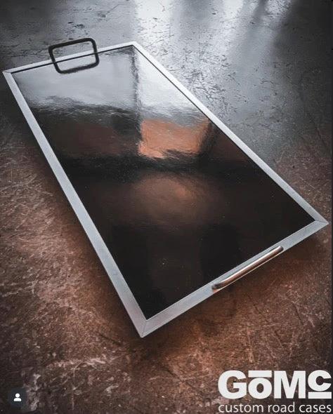 GOMC flat pedalboard with black surface, aluminum frame, and visible GOMC logo