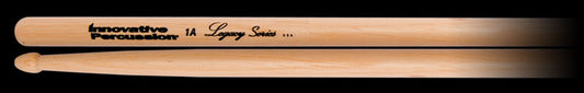 Two wooden drumsticks on a black background, with the top stick showing the text 'Innovative Percussion 1A Legacy Series .