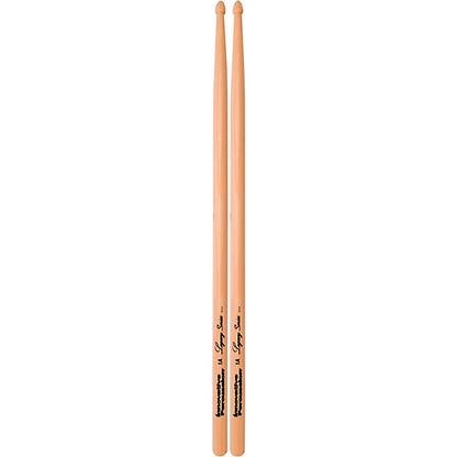 Two wooden drumsticks standing upright on a plain white background, with black printed branding and text near the lower section.