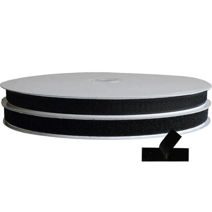 Roll of black ribbon on a white background