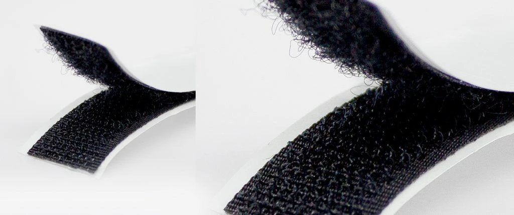 Close-up of black adhesive strips on a white background