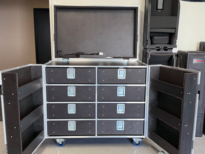 Black storage unit with drawers and open doors on wheels