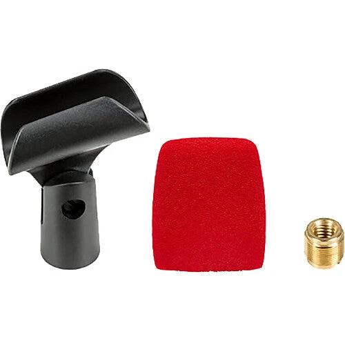 Black cleaning tool, red foam block, and brass fitting on a white background