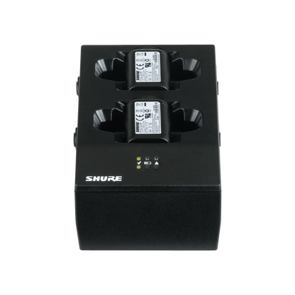 Shure wireless transmitter battery packs on a white background